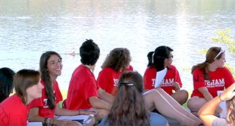 An image of pre-college students outside by the river. 